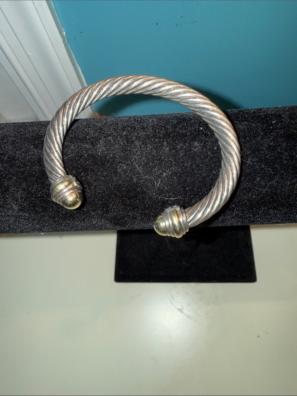 David Yurman Cable Classic bracelet in sterling silver with 14k gold dome tips.
